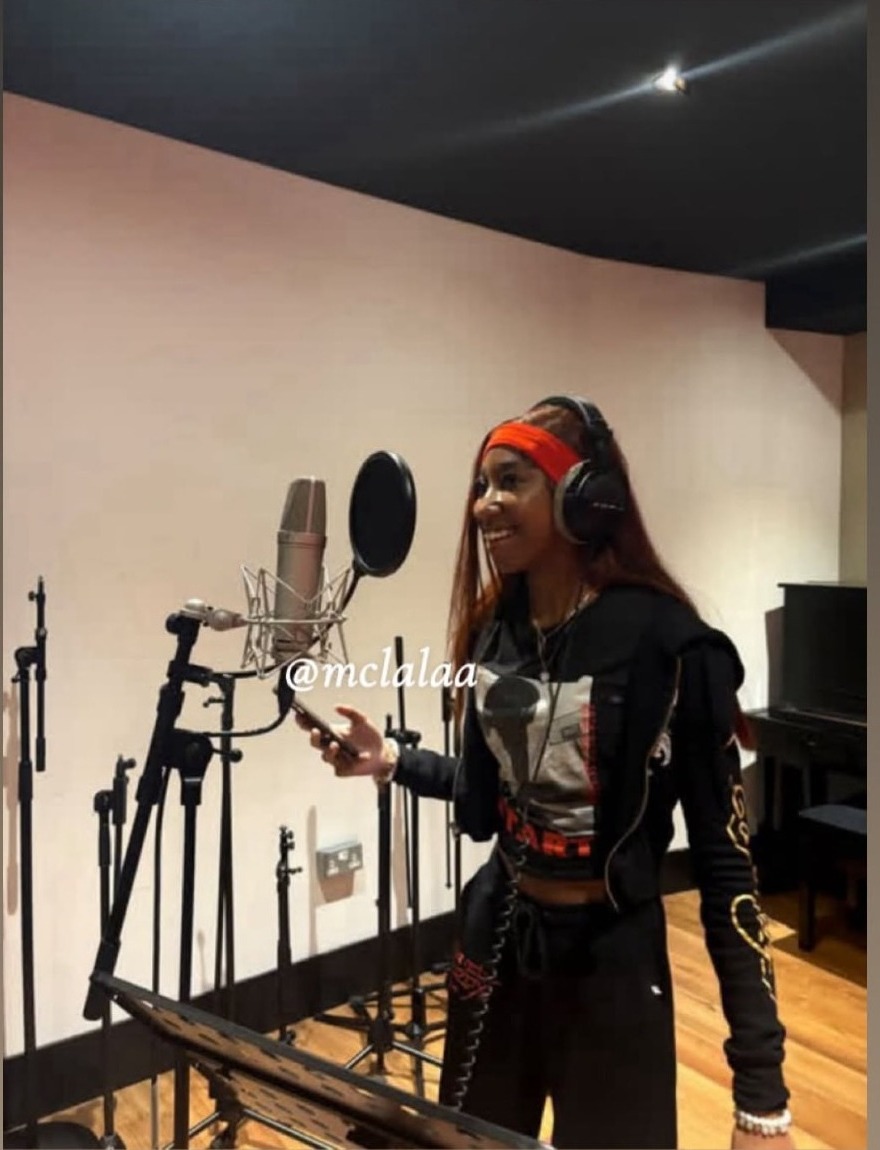 MC Lala recording in the studio